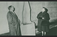 Murray Blum’s parents visiting the Cambridge American Cemetery in 1958.