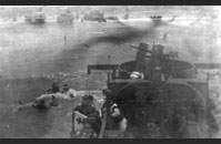 Dog Red Omaha - LCI 94, Omaha Beach, Normandy - A medical detachment from the 3rd Battalion, 116th Infantry Regiment, 29th Infantry Division lands at Dog Red, Omaha Beach. This never-before-published image captures some of the chaos of the early morning landings on June 6, 1944. Gift of Mrs. Charles Jarreau, The National WWII Museum, 1992.001