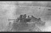 Dog Red Omaha #2 - LCI 94, Omaha Beach, Normandy - Landing Craft, Infantry 94 noses onto the beach. It carried soldiers from the 3rd Battalion, 116th Infantry Regiment, 29th Infantry Division. Gift of Mrs. Charles Jarreau, The National WWII Museum, 1992.001