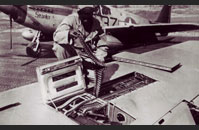 Tuskegee Airman reloading plane artillery